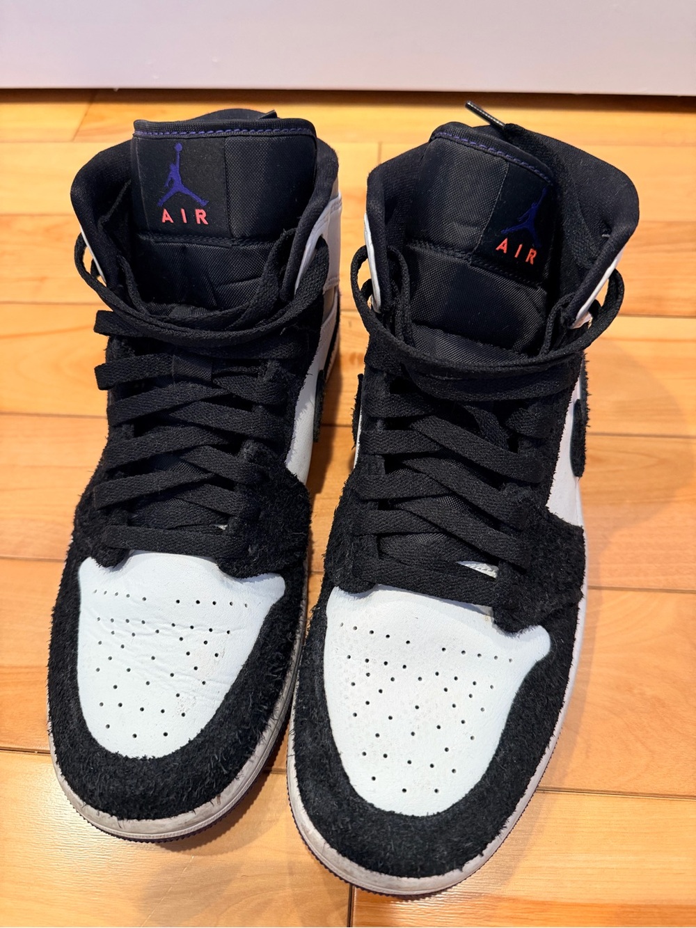 Jordan High-Top Sneakers in Black and White with Purple Logo
